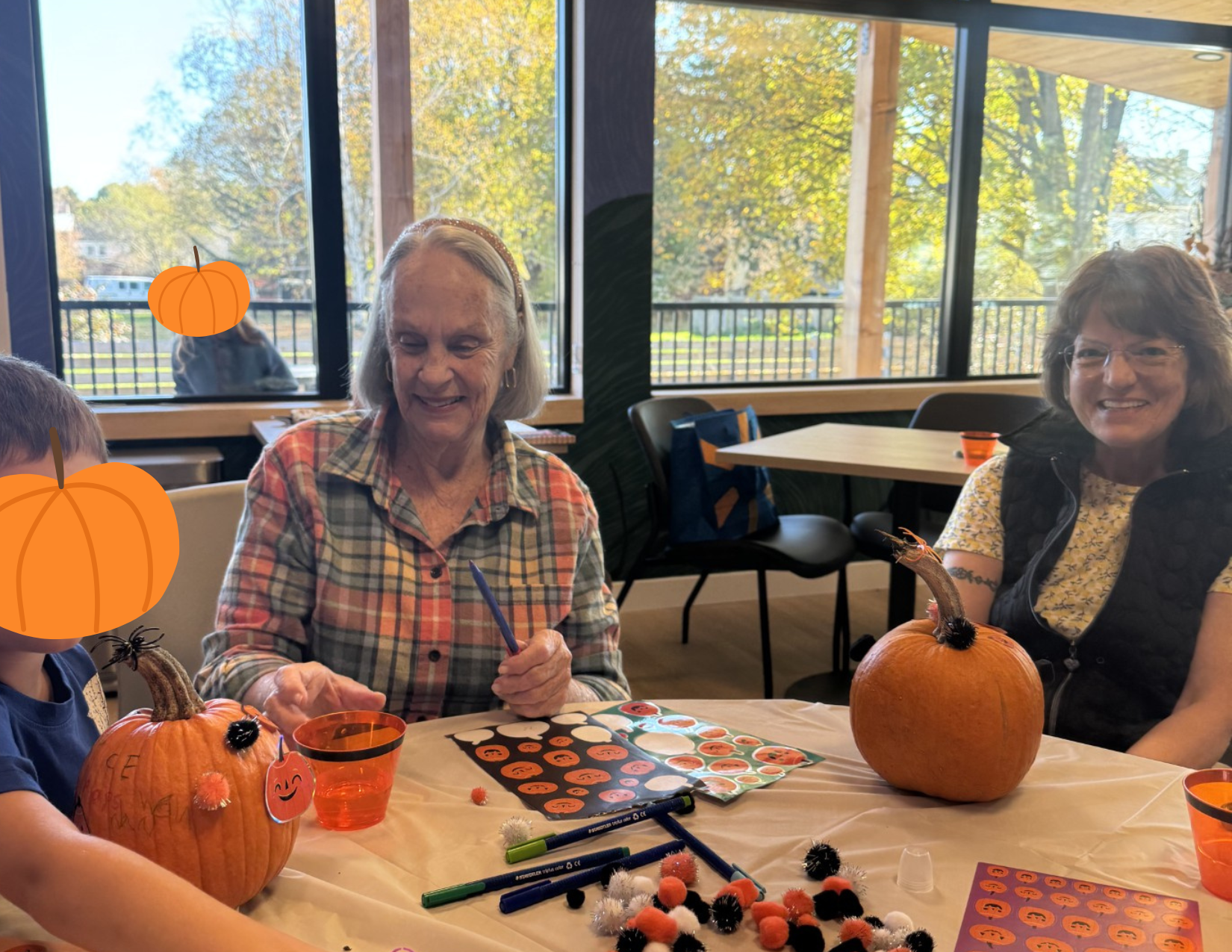 image of people at Marsh House painting pumpkins